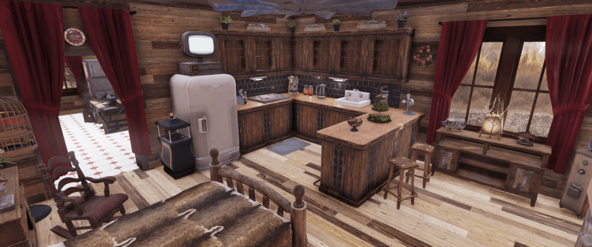 Inside a cabin elevated over water on stilts in the game Fallout 76. This room is the the living area that has a fireplace, bed, kitchen and eating area. There is a back door that exits to the deck.